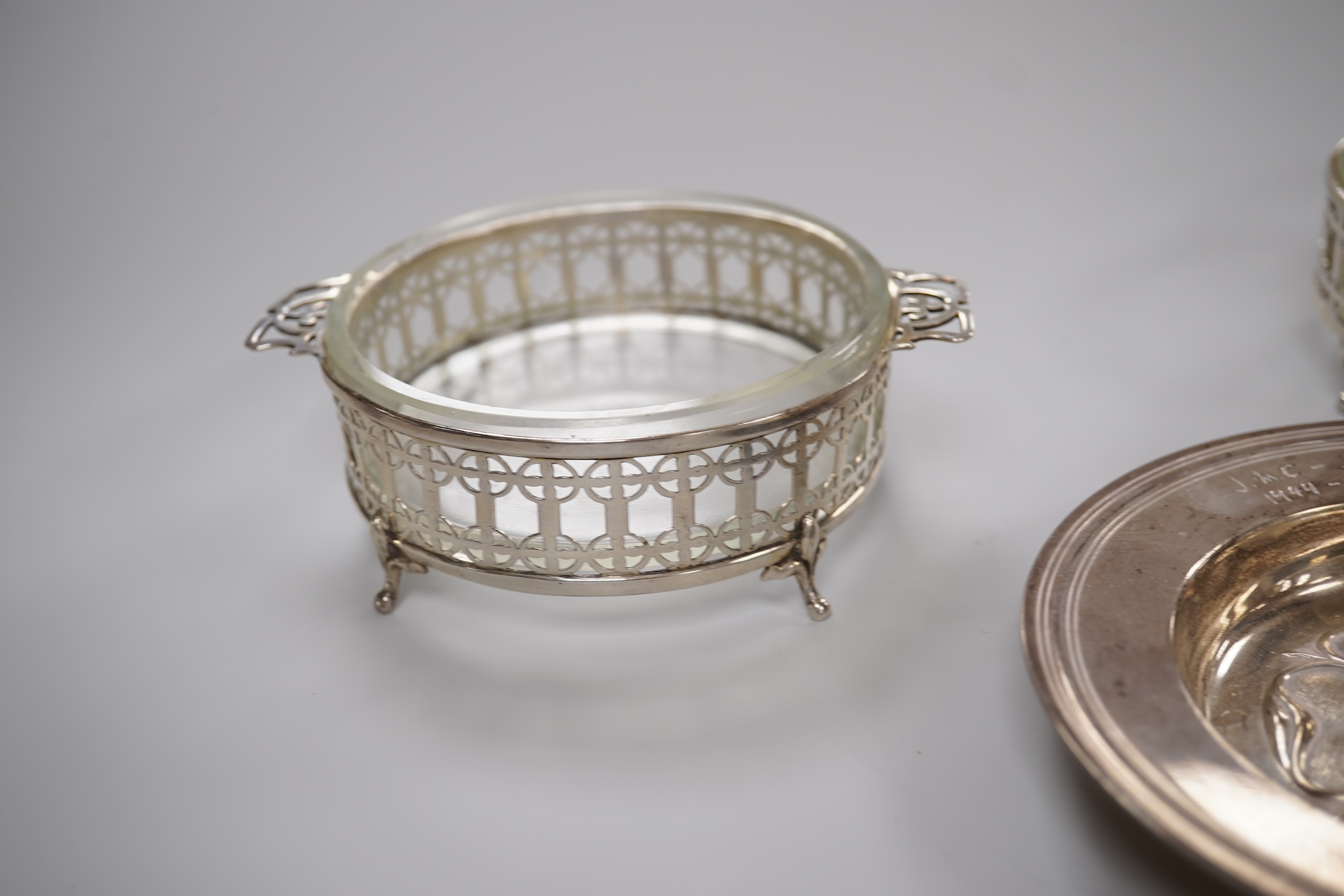 A 1970's silver 'Tudor Rose' dish, by Asprey & Co Ltd, diameter 11.8cm, together with a pair of George V silver mounted glass butter dishes.